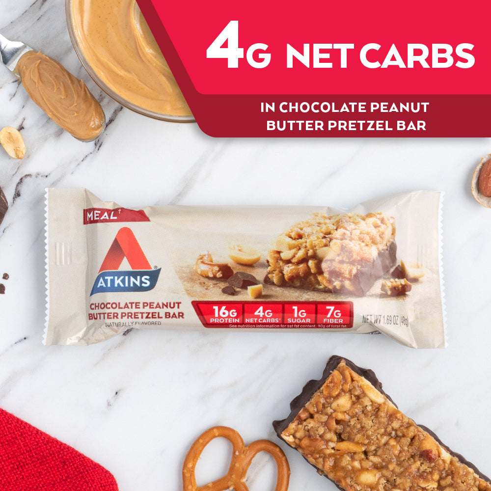 Chocolate Peanut Butter Pretzel Bar with pretzel and peanut butter, red cloth on marble table; 4G Net Carbs in vanilla caramel pretzel bar